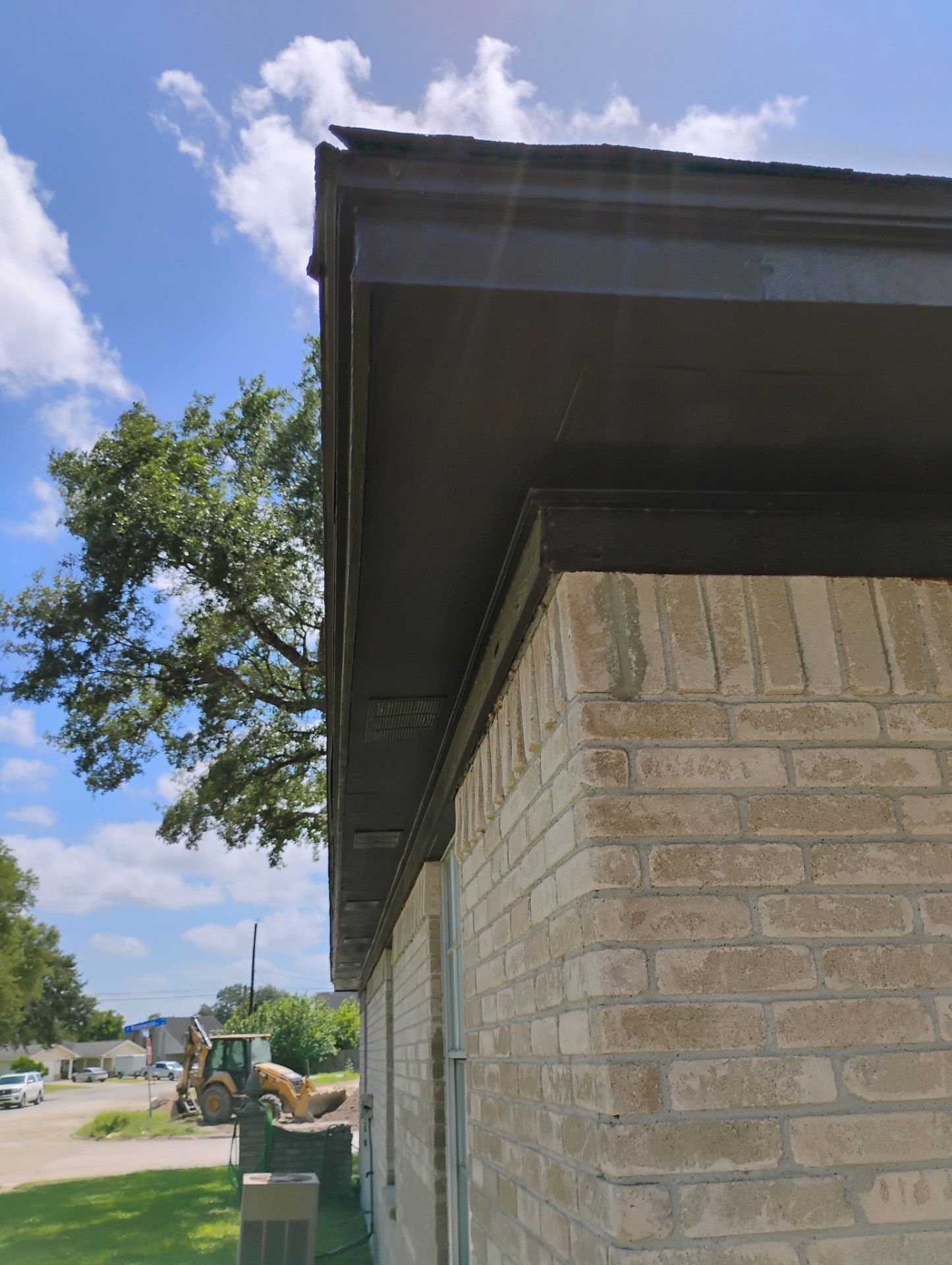 Repaired and painted fascia, soffit, and trim on a Victoria TX brick home