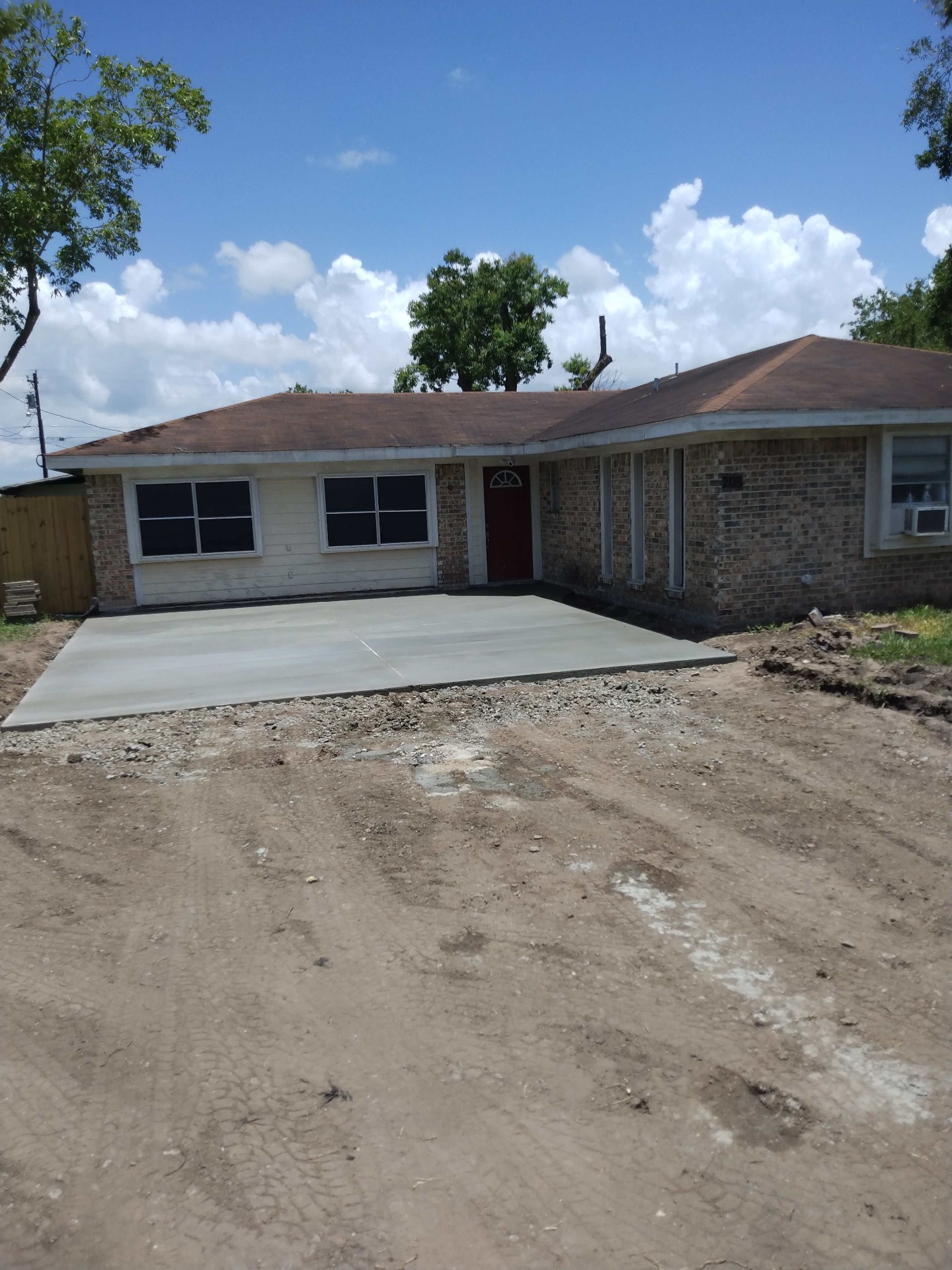 Finished concrete driveway poured at a Victoria TX brick home