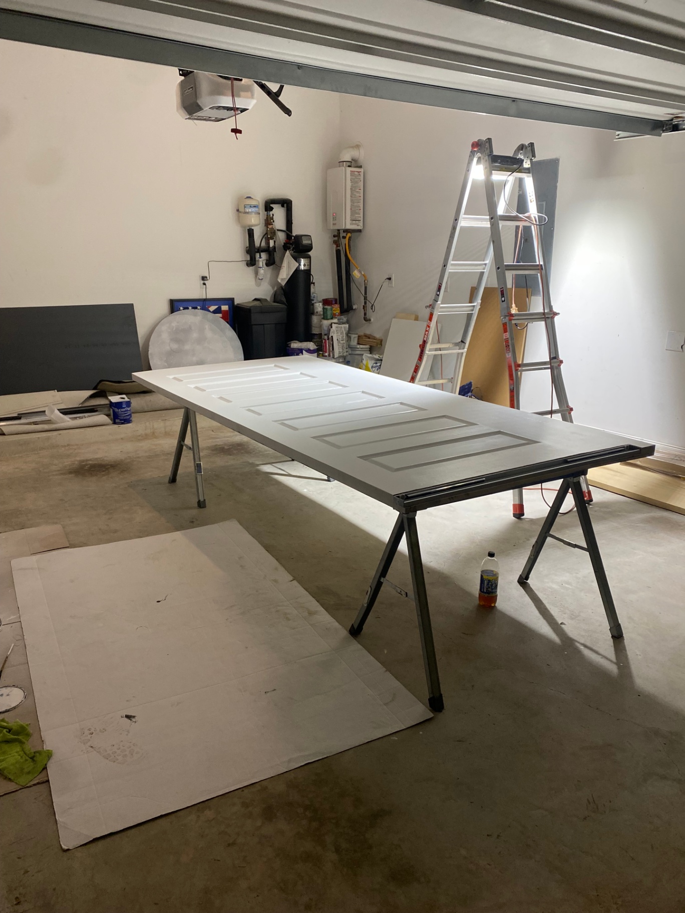Interior door being prepped and painted in a garage workshop
