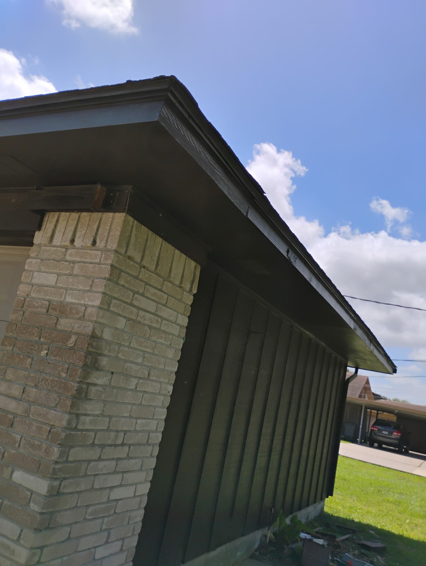 Dark green painted siding and trim on a Texas home exterior
