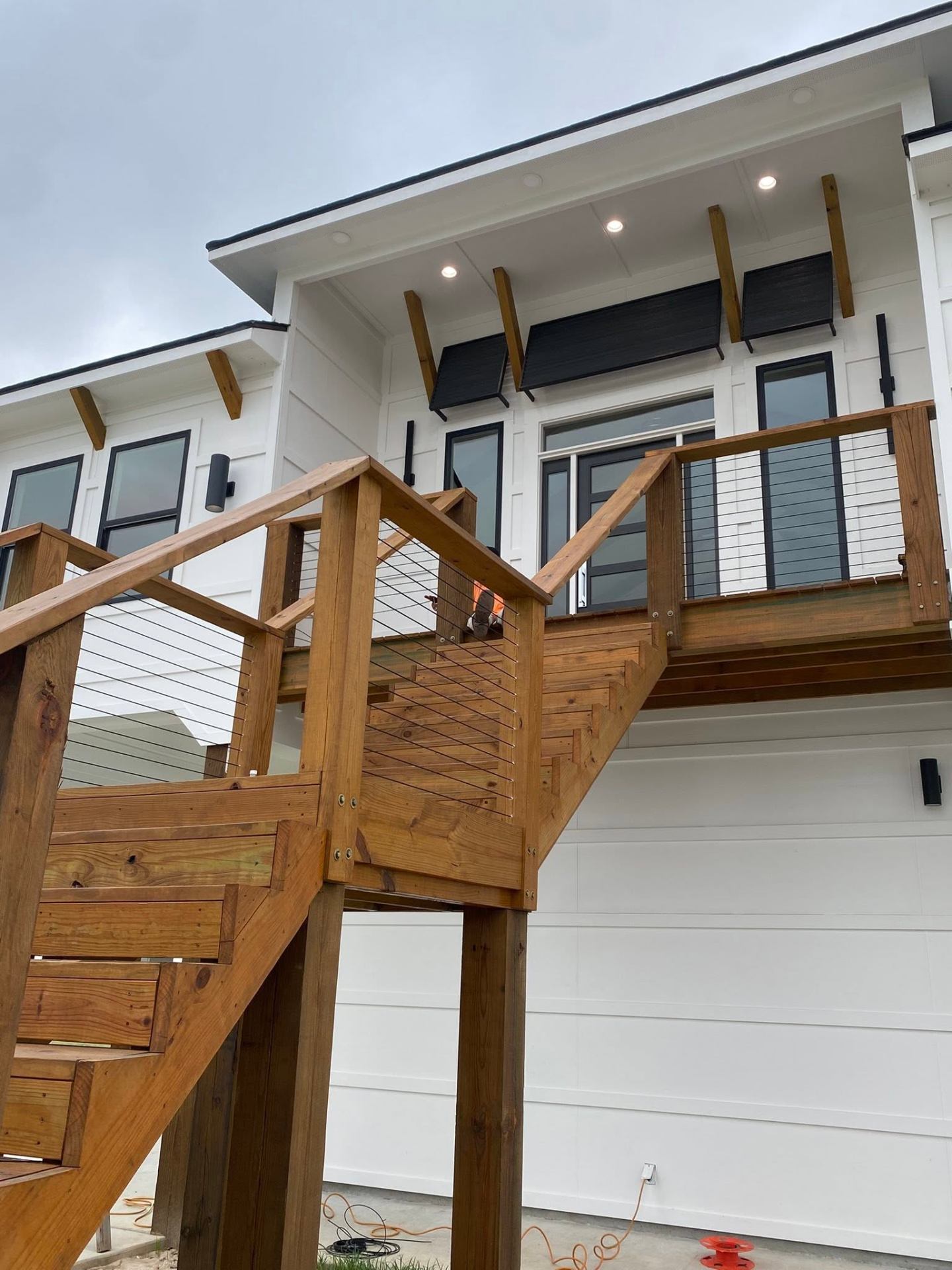 Custom cedar deck and staircase on a modern farmhouse build